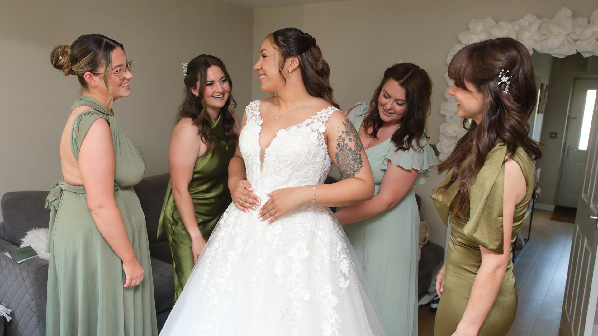 Bridesmaids helping bride in final preparations for her wedding, Suffolk Wedding Photographer, Heffs Photography, 