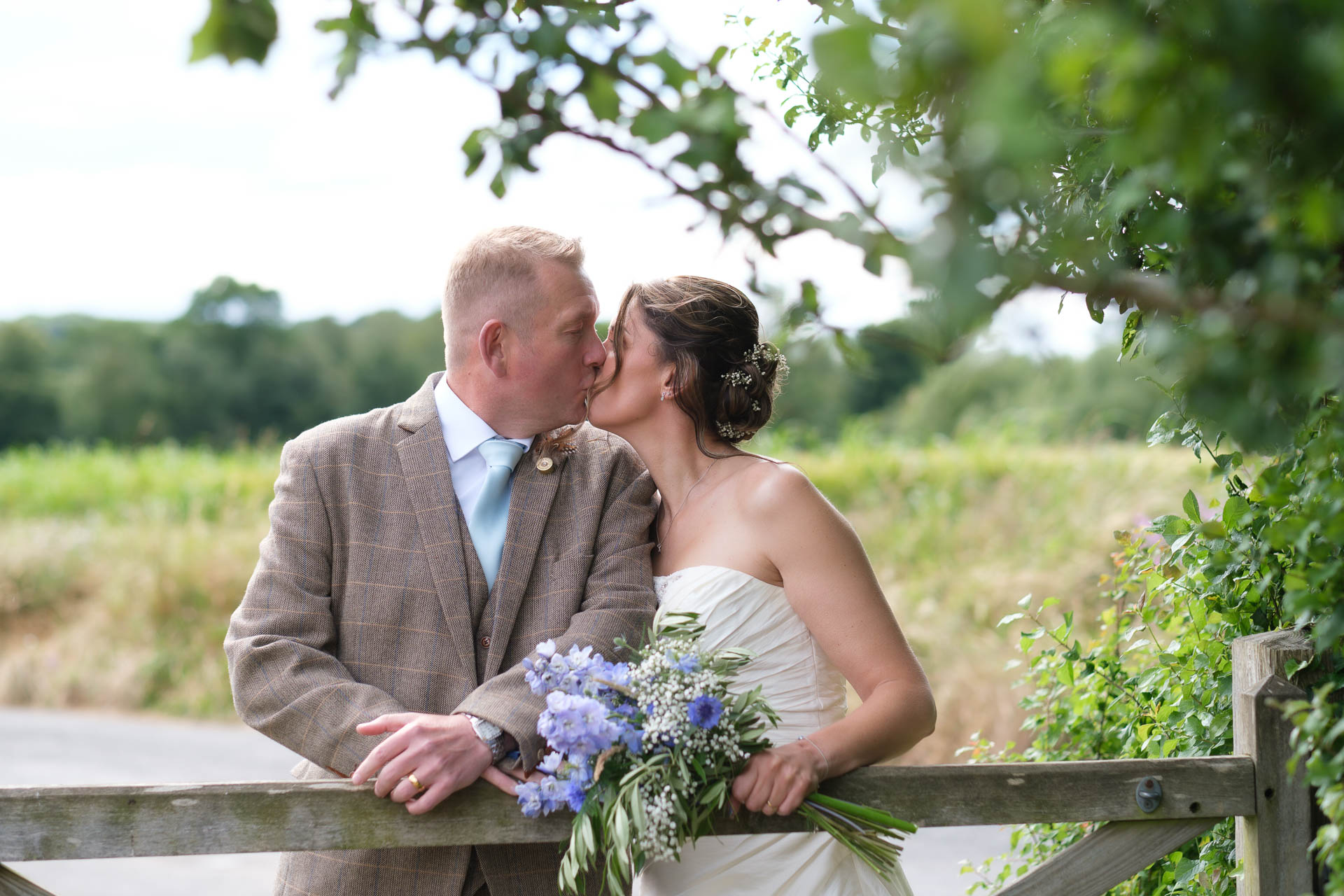 Couple kissing with a beautiful sunset at All Manor of Events Heffs Photography