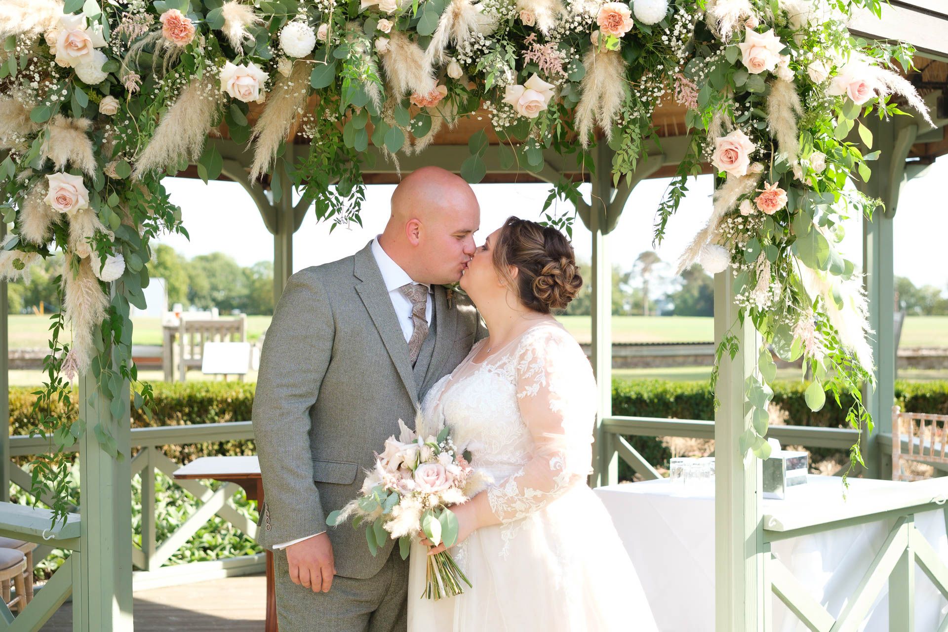 Couple kissing with a beautiful sunset at All Manor of Events Heffs Photography