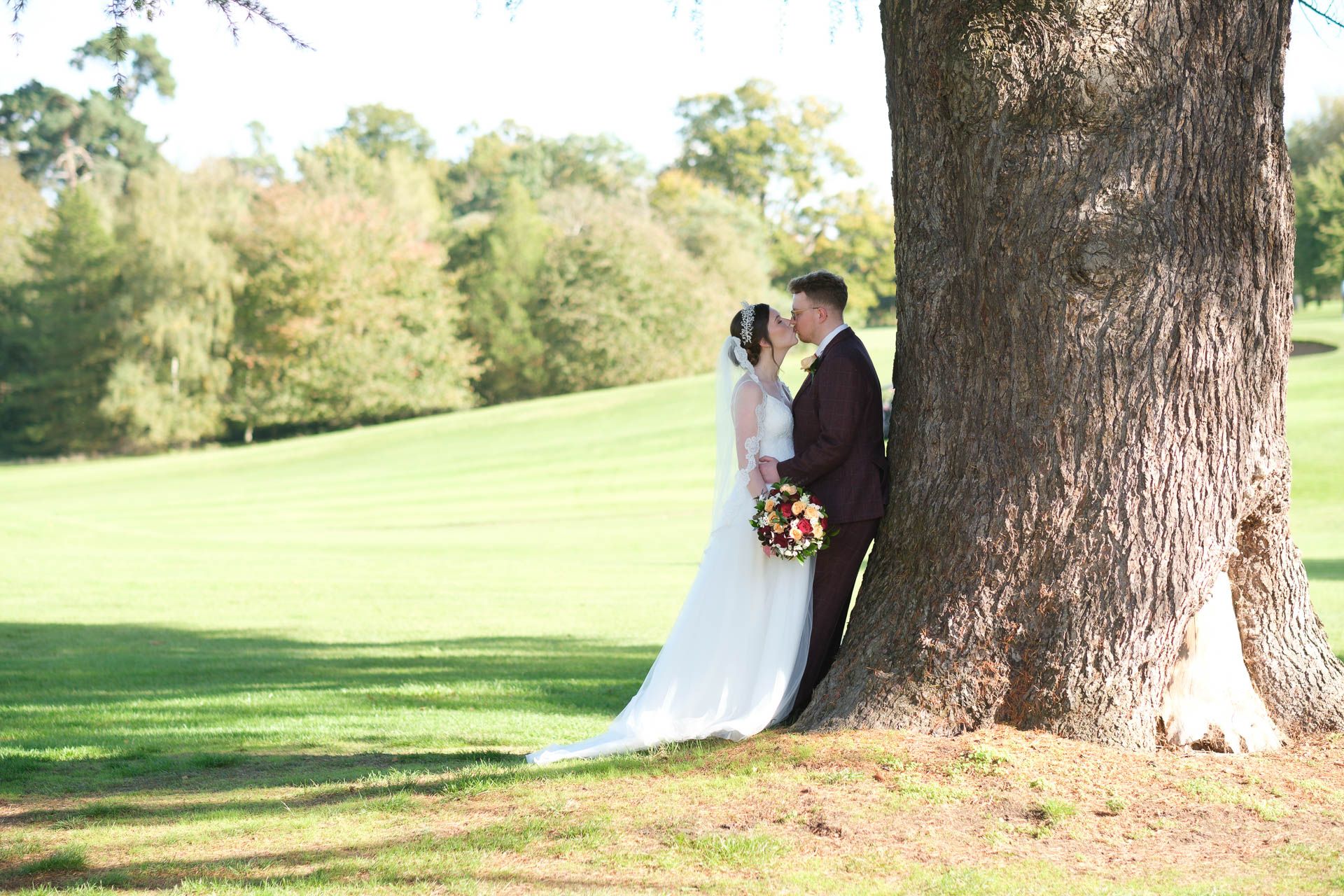 Couple kissing with a beautiful sunset at All Manor of Events Heffs Photography